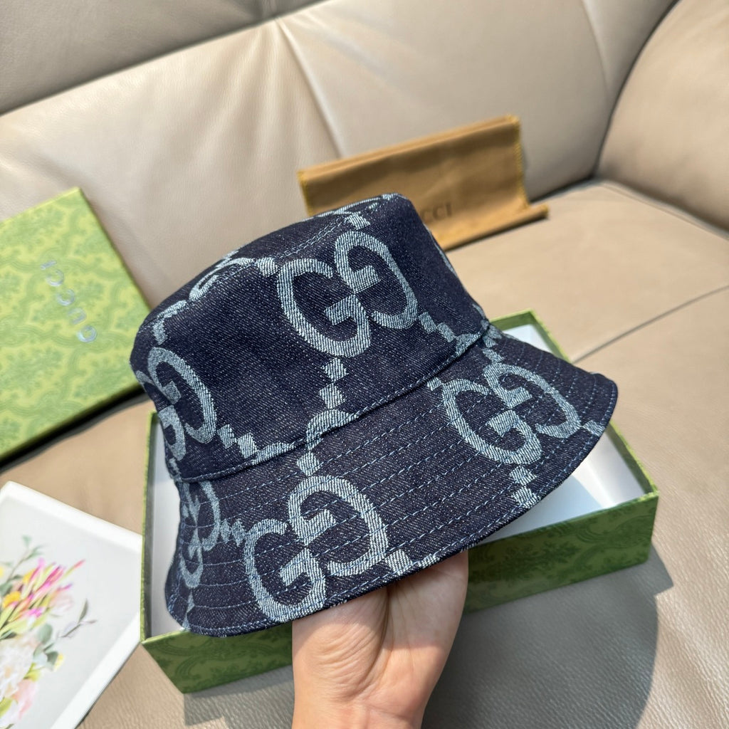 Gucci cap angled view in dark blue denim with white GG monogram allover print