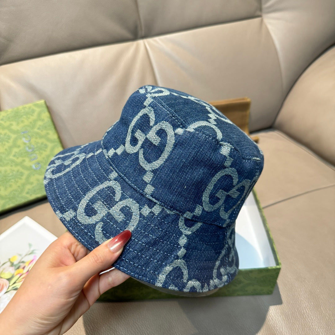 Denim bucket hat with GG monogram pattern, blue top view showing stitched brim