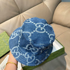 Gucci blue bucket cap with white GG logo pattern, back view with curved brim.