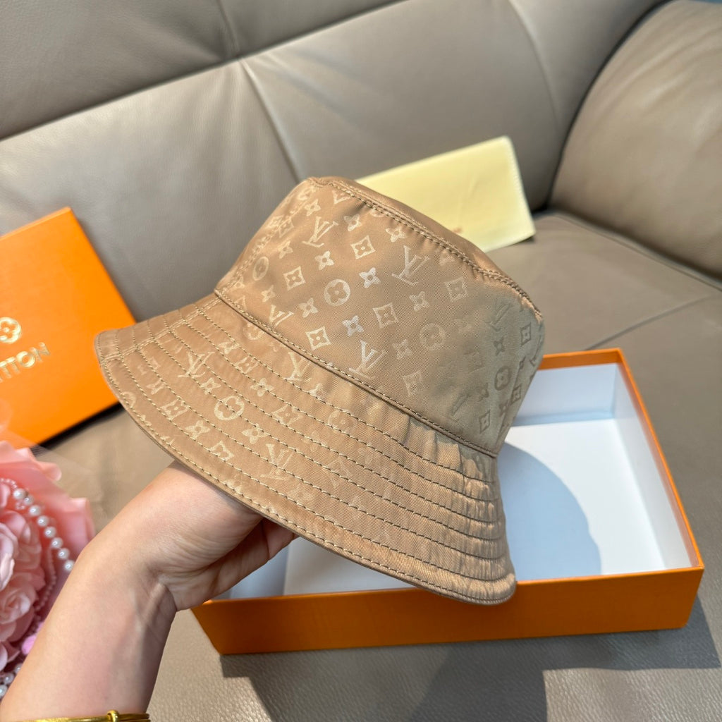 Louis Vuitton bucket hat beige monogram canvas, side view with wide stitched brim
