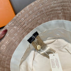Louis Vuitton bucket hat inside brim close-up with tags on cream lining