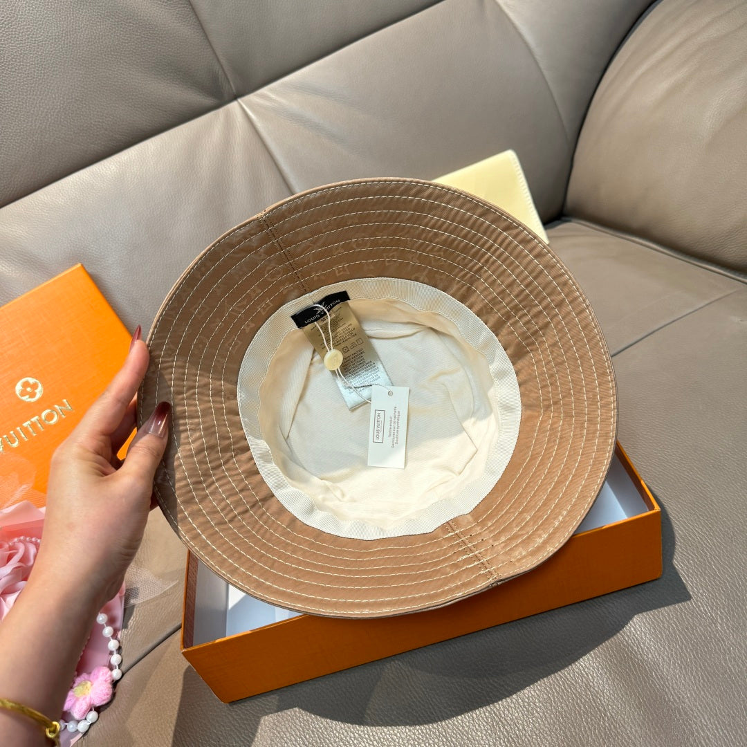 Louis Vuitton bucket hat interior view with cream lining and attached paper tag