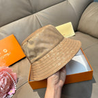 Louis Vuitton bucket hat light brown monogram canvas, angled view of wide brim