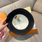 Louis Vuitton monogram bucket hat, black, underside view with fabric lining and tag