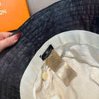 Louis Vuitton monogram bucket hat, dark blue interior view with cream lining and label