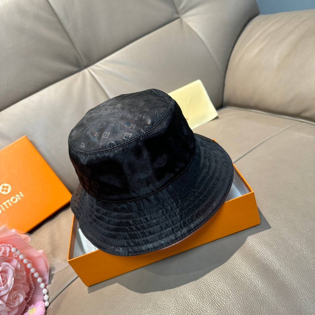 Louis Vuitton monogram bucket hat, dark blue, angled side view with monogram pattern