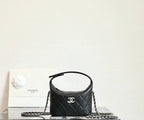 Black quilted handbag with chain strap and Chanel logo front, top handle