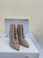 Women’s lace-up ankle boots, beige patterned uppers, front view pair