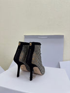 Women’s lace-up ankle boots with monogram print, back view, stiletto heel