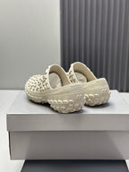 Balenciaga white slide sandals, back view showing cushioned collar and tread sole
