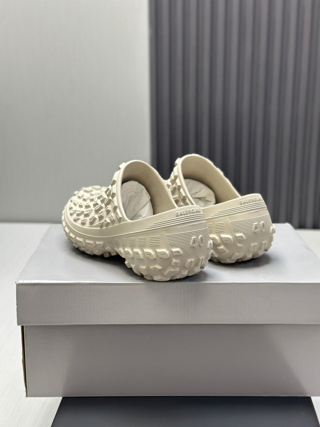 Balenciaga white slide sandals, back view showing cushioned collar and tread sole