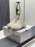 Balenciaga white textured slide sandals on a box, chunky rubber tread sole