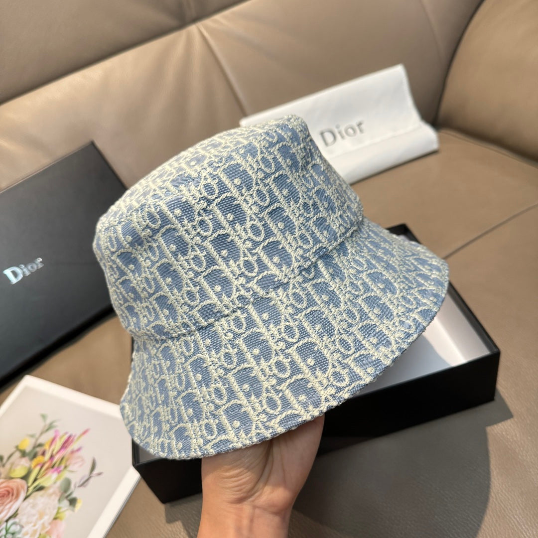 Dior bucket hat in light blue with Dior monogram pattern, angled view