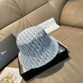 Dior monogram bucket cap in light blue with an all-over white pattern