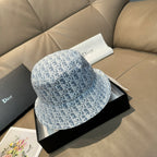 Dior monogram bucket cap in light blue with an all-over white pattern