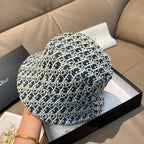 Monogram bucket cap in navy with white pattern, close-up side view