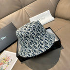 Monogram bucket cap in navy and white, side view with curved brim