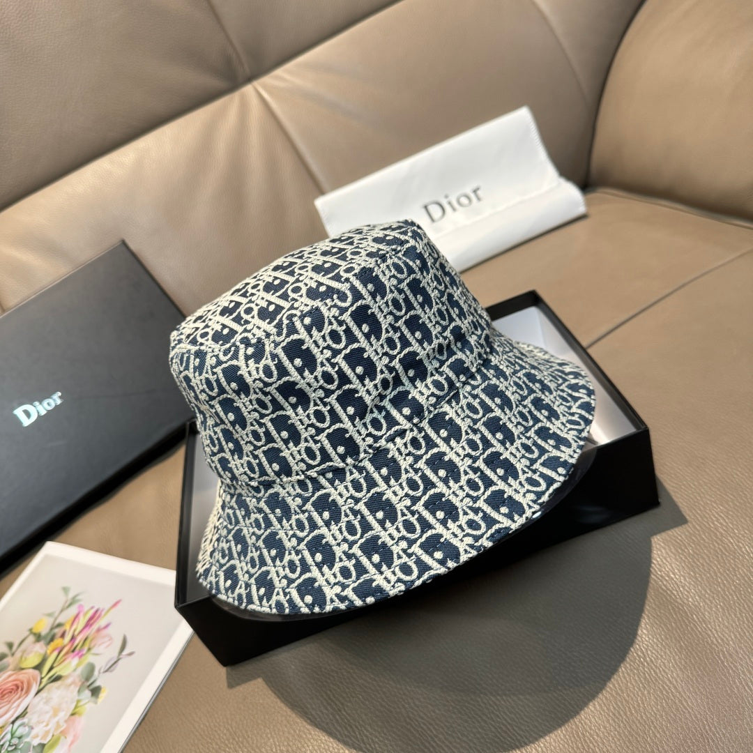 Monogram bucket cap in navy and white, side view with curved brim