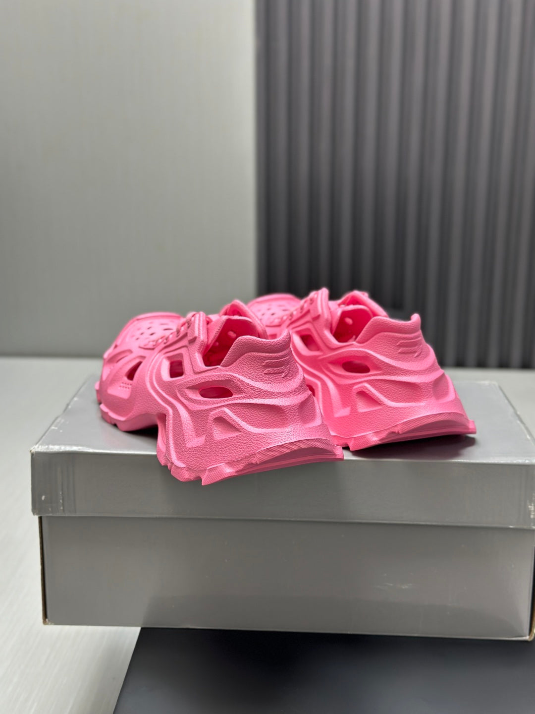 Balenciaga pink chunky sandals, top view on box showing rugged tread and straps