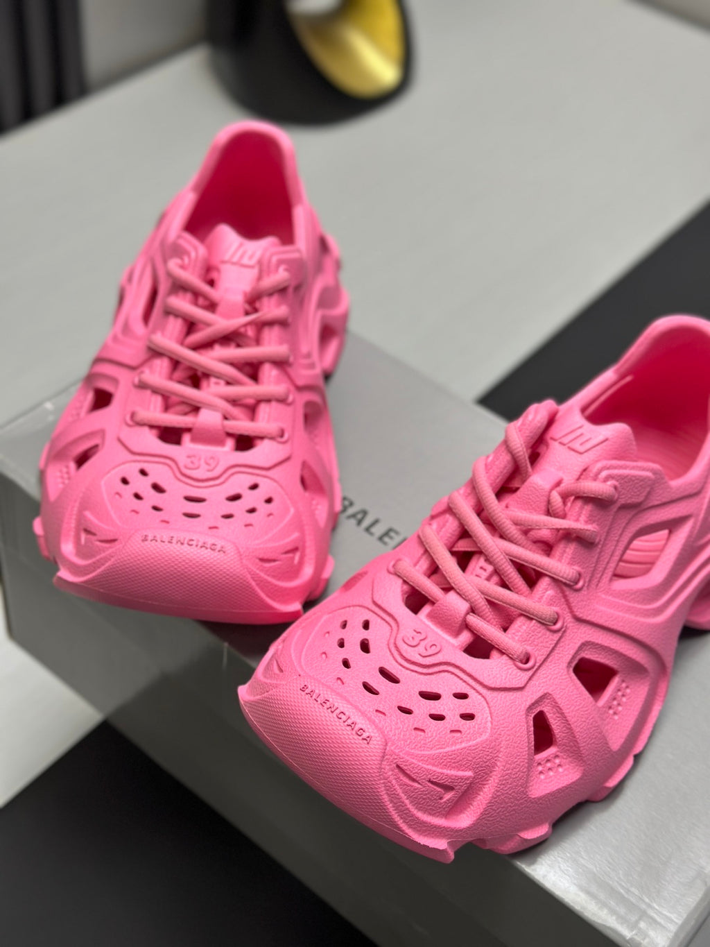 Balenciaga pink lace-up chunky sandals close-up, textured upper with perforations