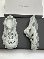 Balenciaga sandals, light gray, back view pair on box with textured sole
