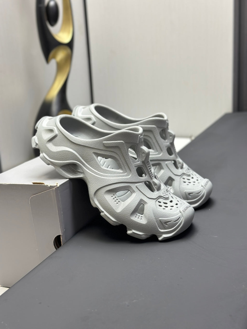 Balenciaga sandals, light gray, angled view showing thick sole and molded upper
