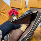 Monogram mini crossbody bag open interior with fabric lining and zip closure.