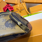 Louis Vuitton monogram belt bag close-up on zipper end with gold-toned zipper pull