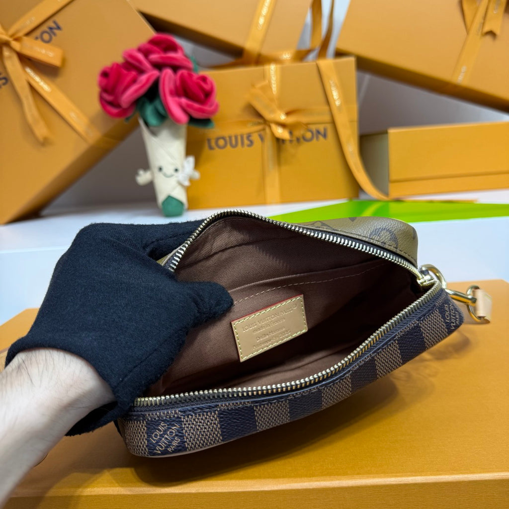 Louis Vuitton zip pouch with dark blue canvas, brown interior, silver zipper and hardware