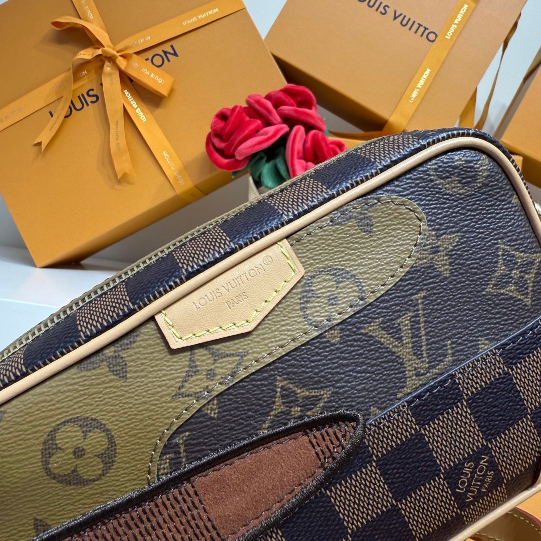 Louis Vuitton monogram crossbody bag, top view with leather tab detail and signature pattern