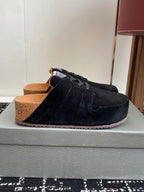 Black suede lace-up sneakers with tan lining and thick sole, side view