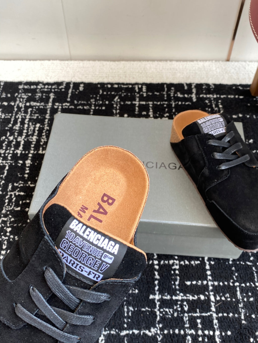 Balenciaga dark suede lace-up shoes, close-up of tan insole logo text