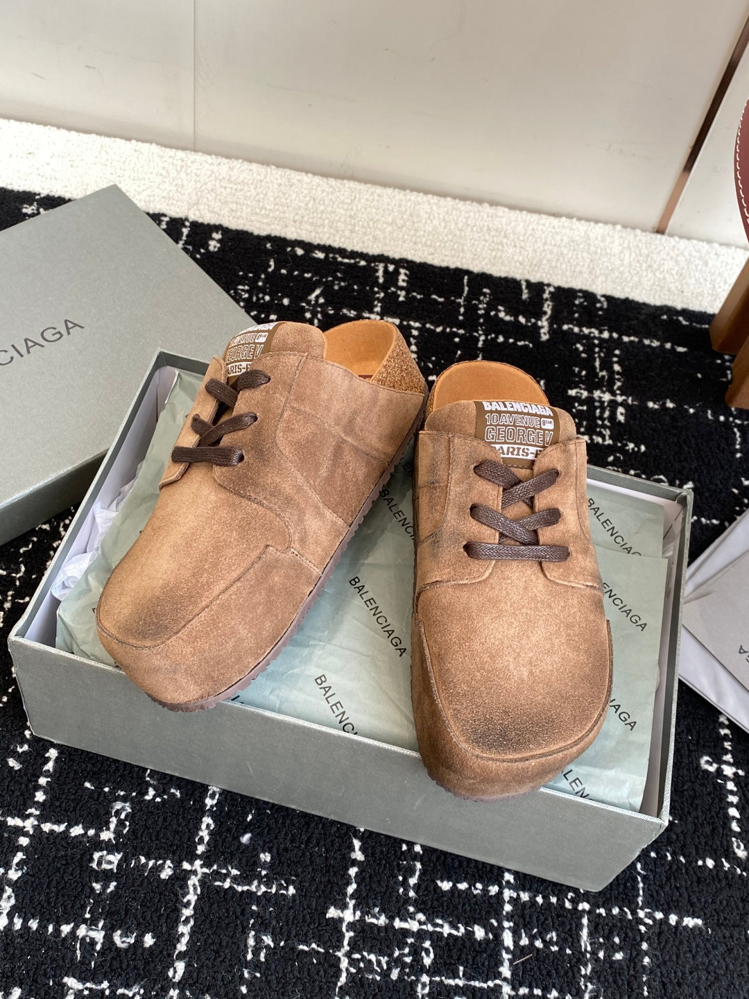 Balenciaga suede lace-up sandals in tan suede, two shoes on display