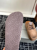 Balenciaga suede lace-up sandals in tan, textured outsole underside visible