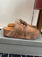 Balenciaga suede lace-up sandals in tan, side view on foot