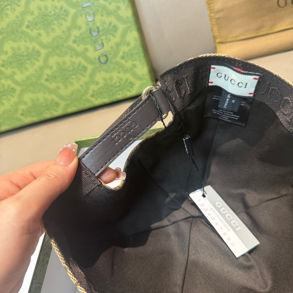 Black baseball cap interior with strap and Gucci tag