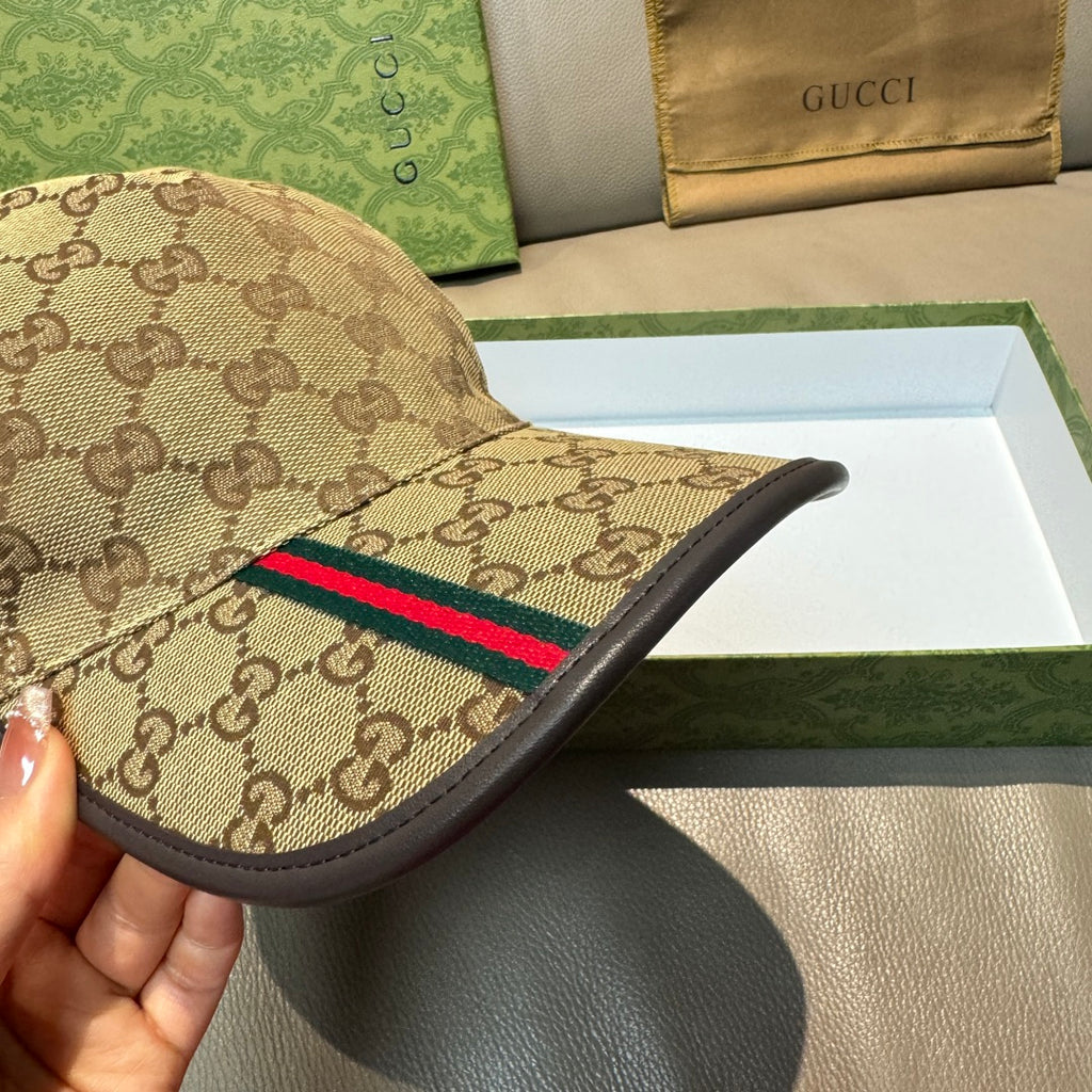 Tan GG baseball cap side view with multicolor Web stripe and black brim