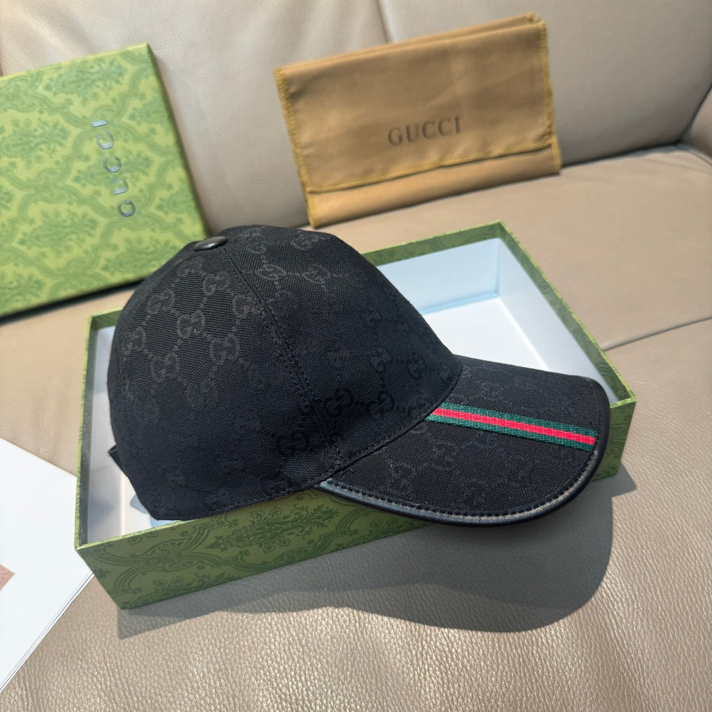 Black Gucci baseball cap with GG monogram pattern and green-red web stripe detail