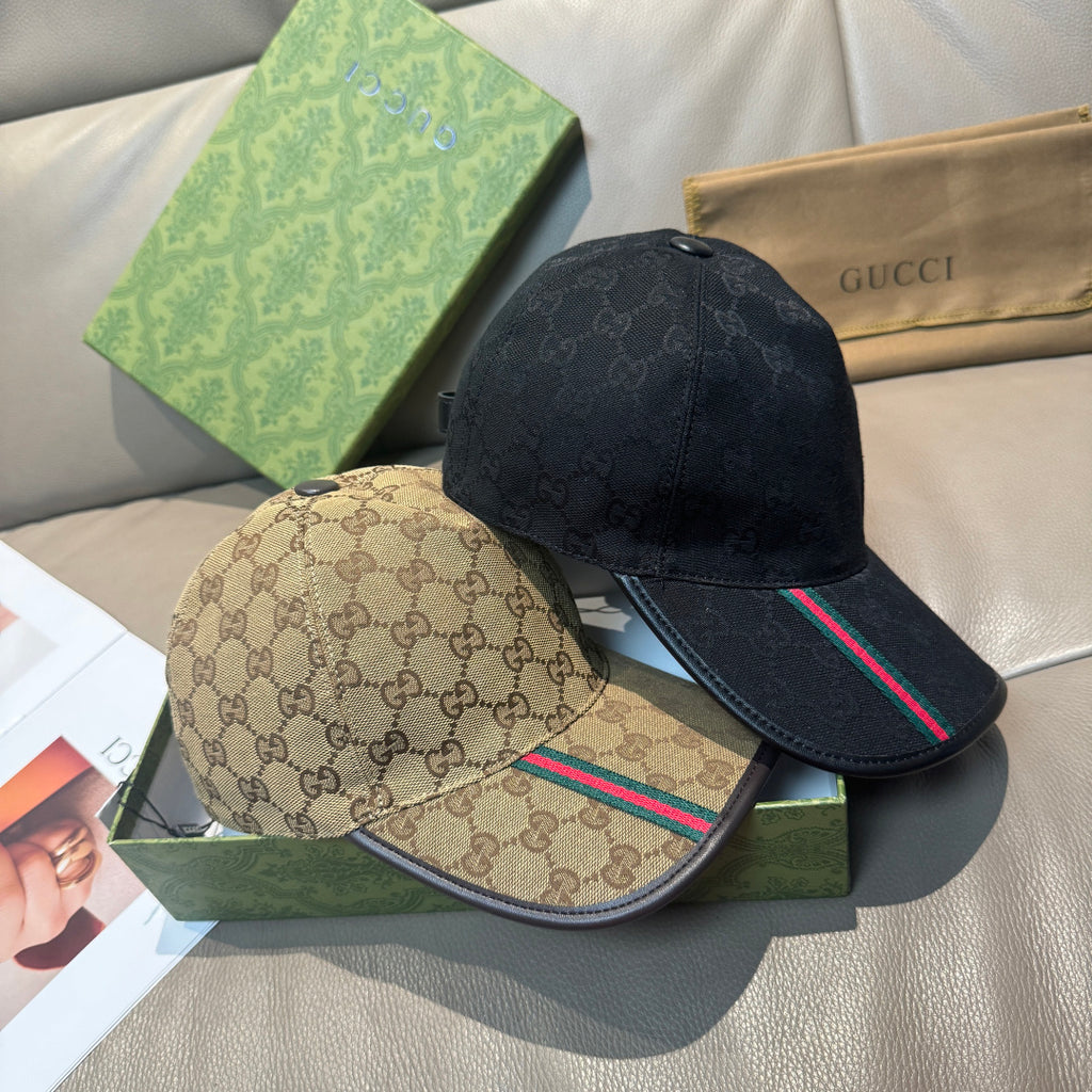 Two Gucci baseball caps: dark monogram cap with stripe, and beige monogram cap with stripe
