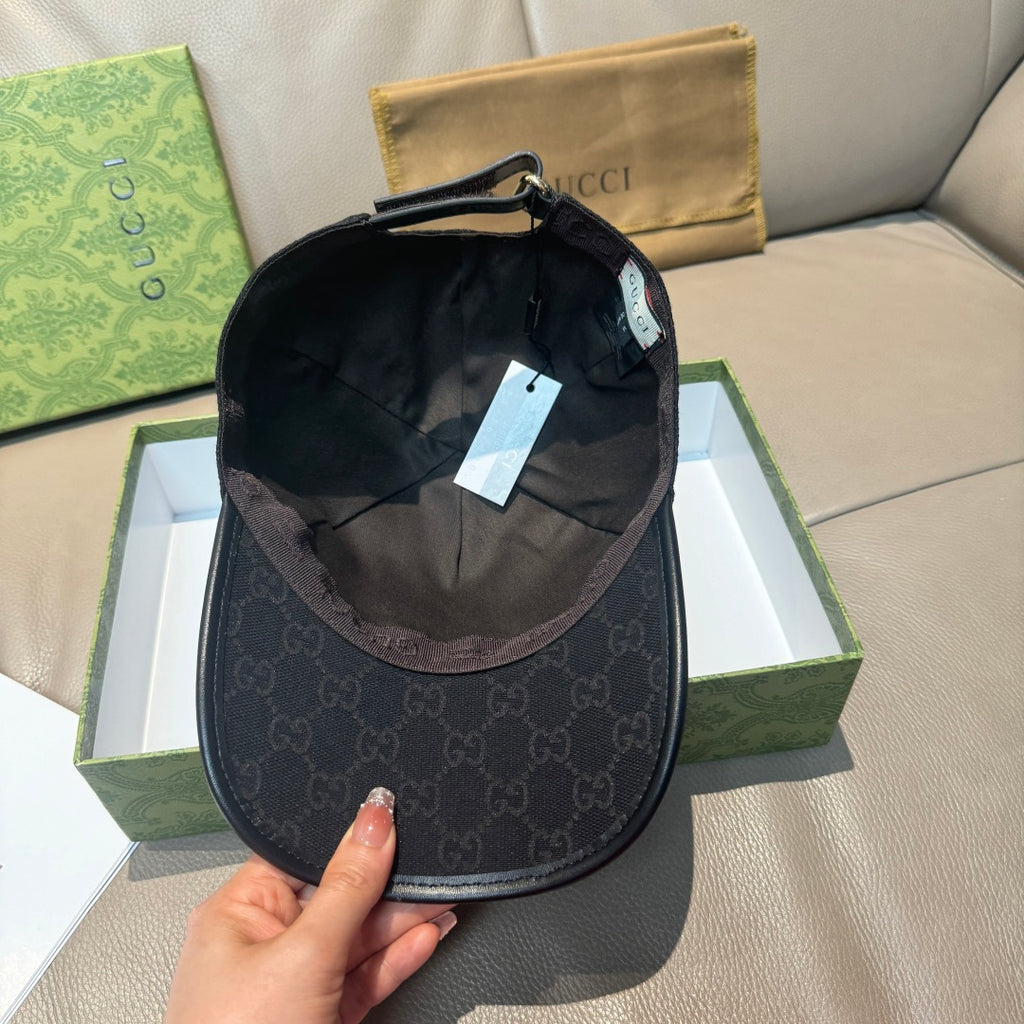 Black Gucci baseball cap interior view with adjustable strap and back panel