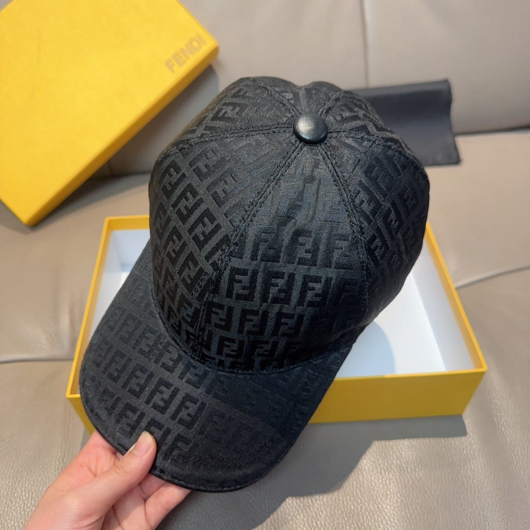 Fendi cap in dark gray FF monogram, domed crown and curved brim, held by hand.