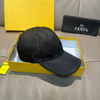 Fendi monogram baseball cap with dark fabric and circular top button, side profile.