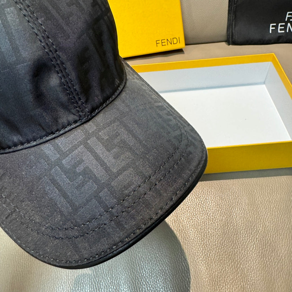 Fendi monogram baseball cap brim, dark patterned fabric with double-row stitching.