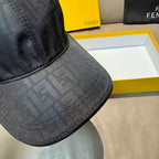 Fendi monogram baseball cap brim, dark patterned fabric with double-row stitching.