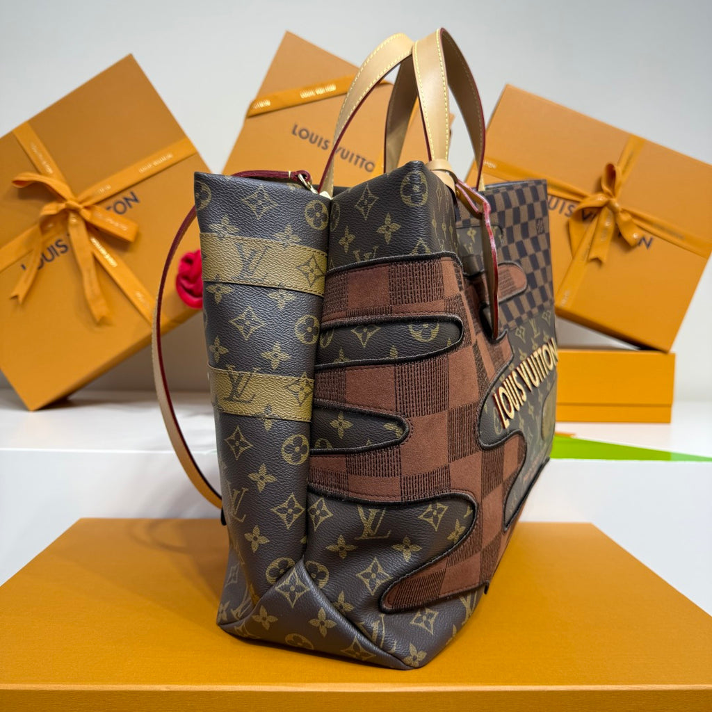 Louis Vuitton monogram tote bag, angled view with patchwork trim and top handles