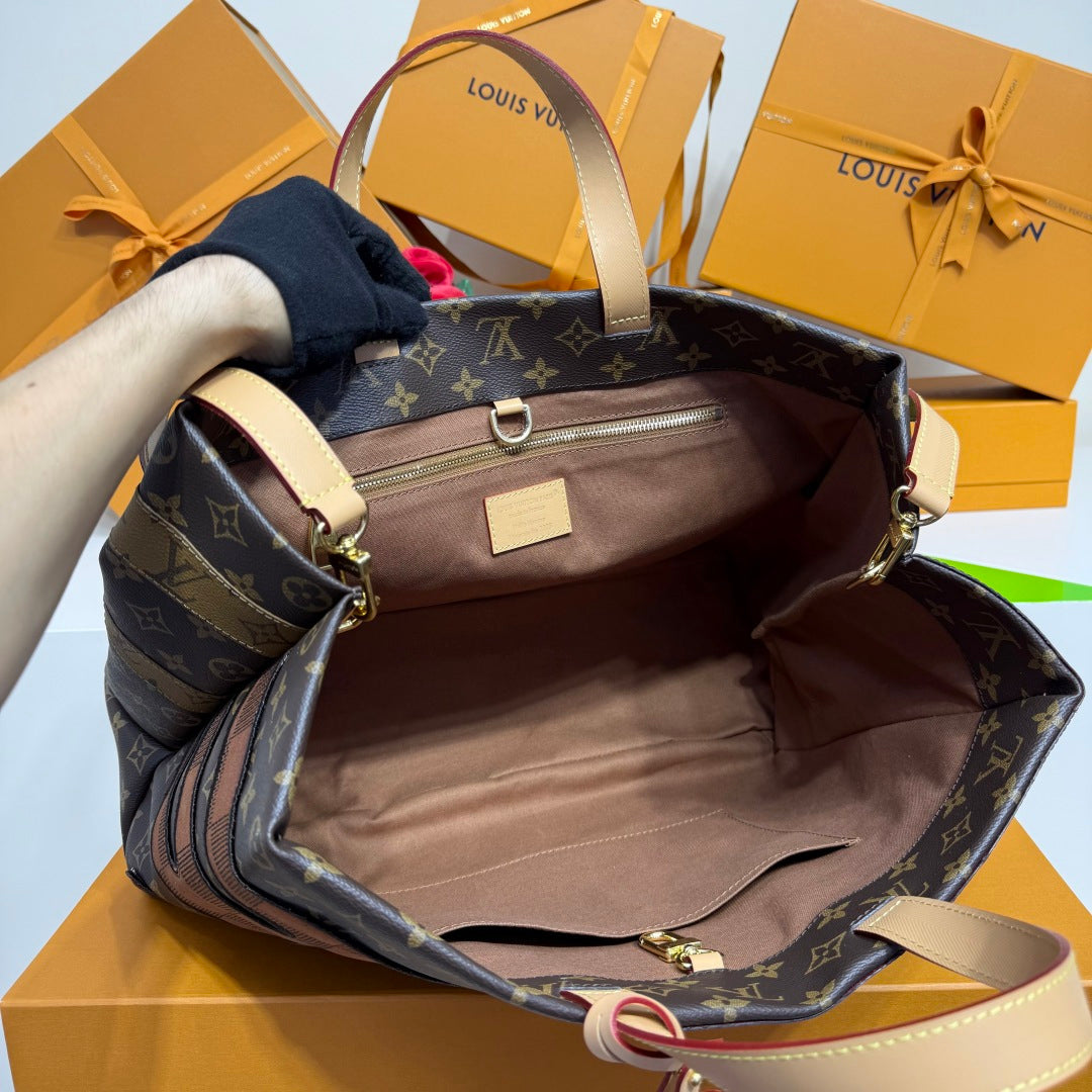 Louis Vuitton monogram tote bag open interior with beige lining and gold zipper