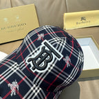 Burberry plaid baseball cap side close-up featuring large TB logo
