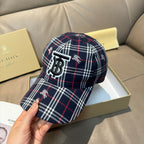 Burberry plaid baseball cap close-up of TB logo and horse motifs