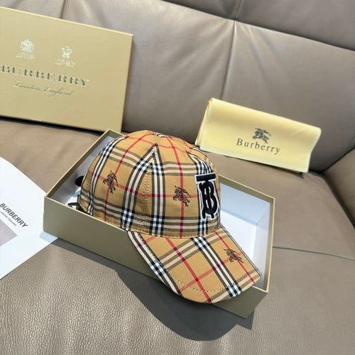 Two plaid baseball caps with embroidered monogram logo: tan/red/black/white and matching style