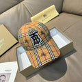 Plaid baseball cap in tan, red, black, and white with embroidered monogram logo